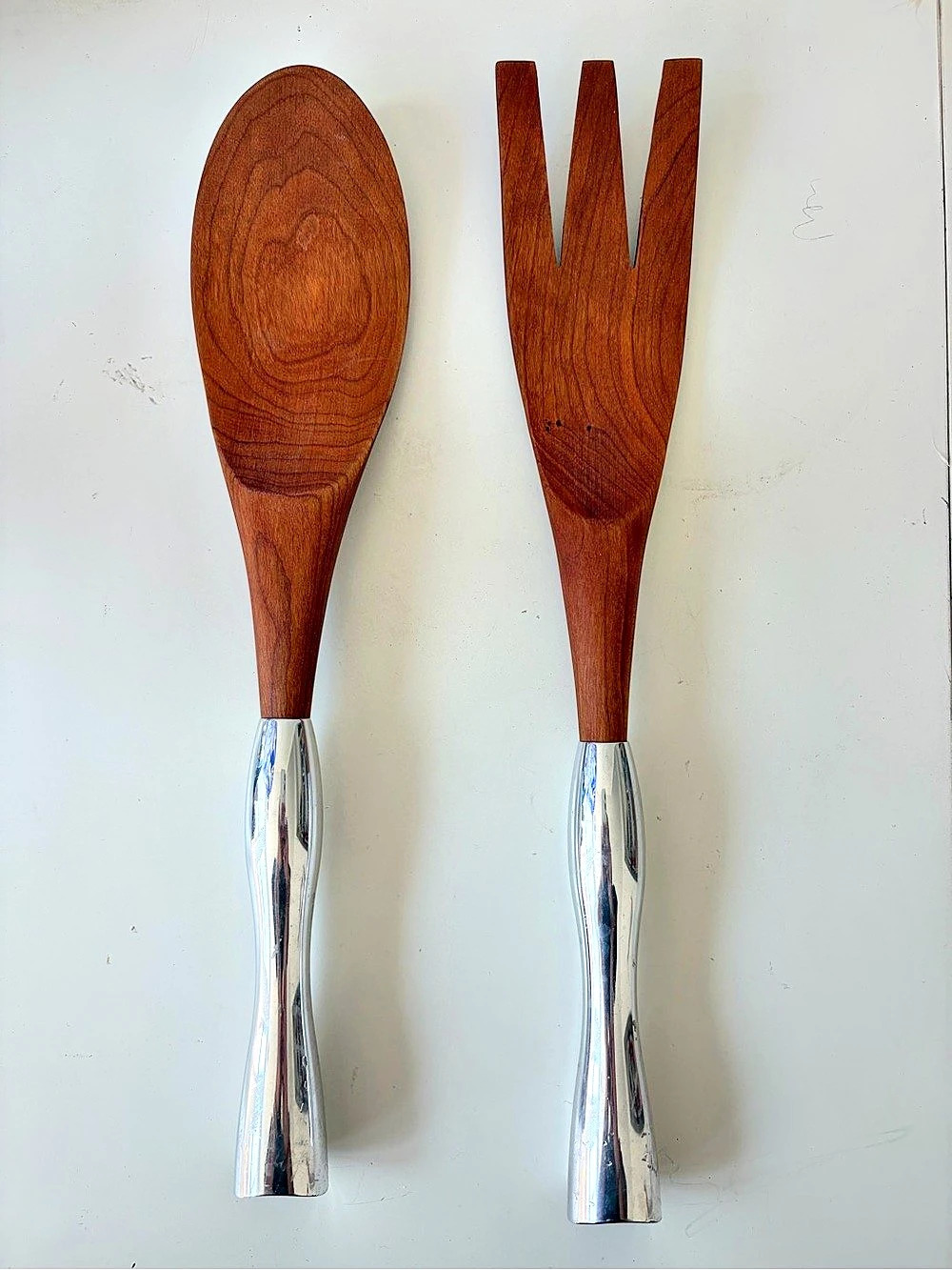 Pair of Nambé Studio cherry wood salad servers with silver-tone metal handles